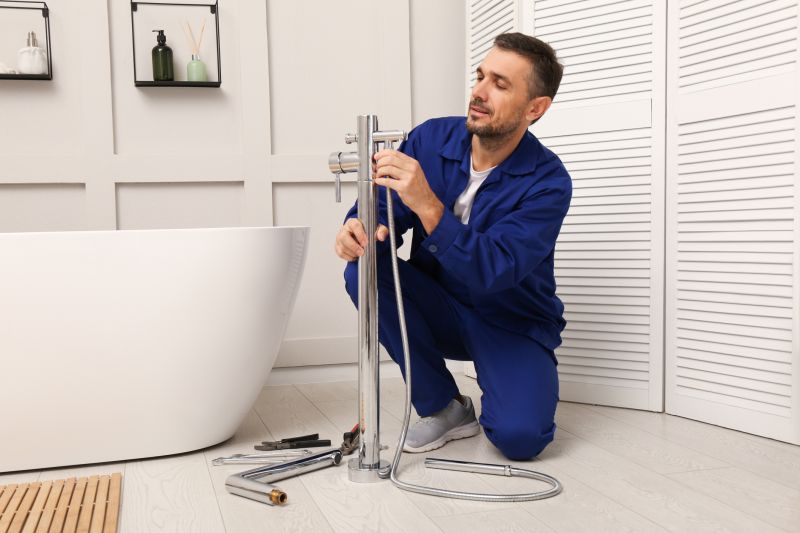 Plumber Adjusting Plumbing